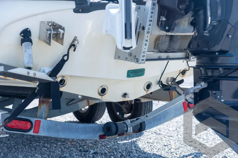 Slide: The Image of 2008 Triton 240 LTS boat trailer hitch and motor detail. - 20
