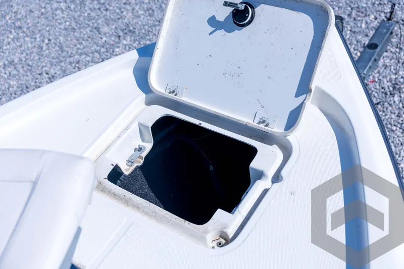 Slide: The Image of Open storage compartment on 2008 Triton 240 LTS boat, showing interior details. - 31