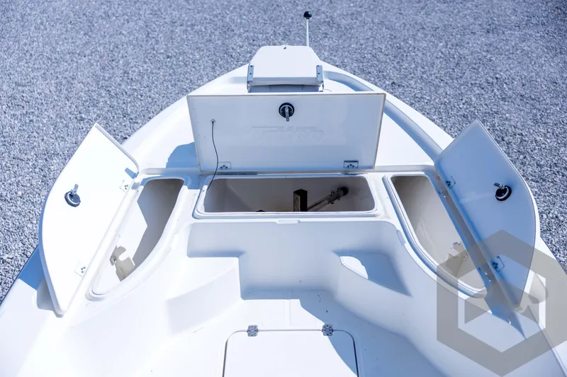 Slide: The Image of 2008 Triton 240 LTS boat storage compartments open on deck. - 32