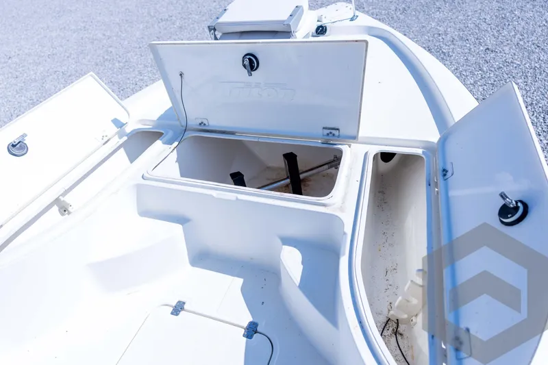 Slide: The Image of 2008 Triton 240 LTS boat storage compartments open, showcasing interior space. - 34