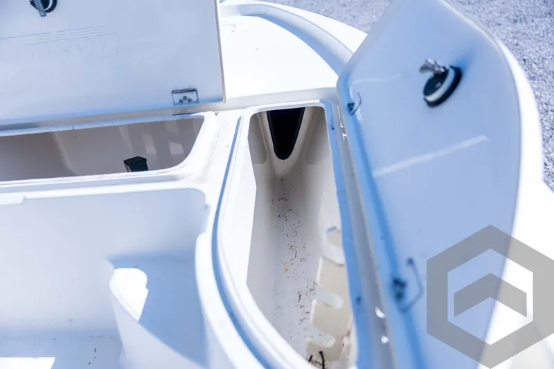 Slide: The Image of Open storage compartments on a 2008 Triton 240 LTS boat deck. - 35