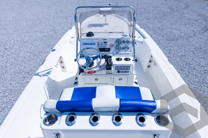 Slide: The Image of 2008 Triton 240 LTS boat interior with steering console and blue seating. - 38