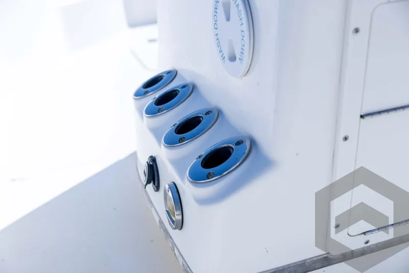 Slide: The Image of 2008 Triton 240 LTS boat rod holders and washdown feature. - 43