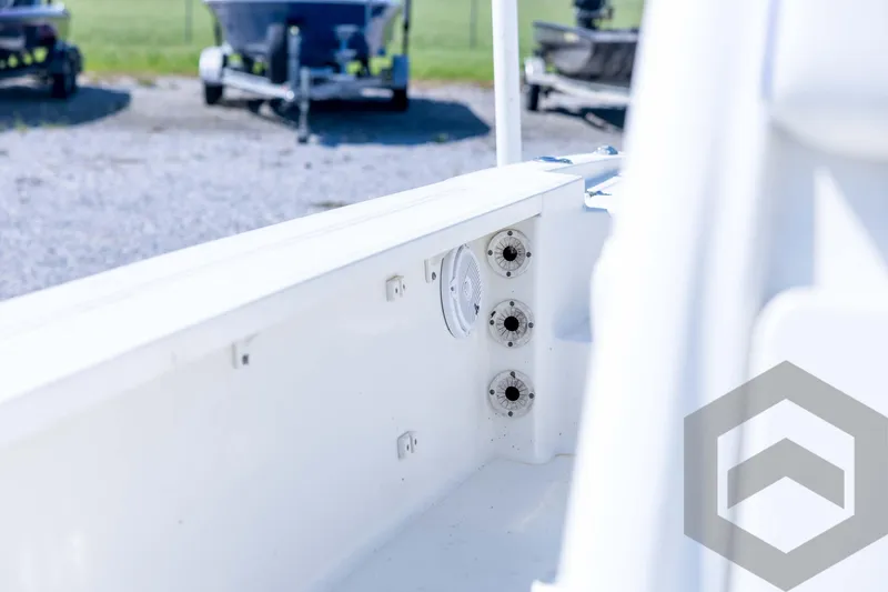 Slide: The Image of 2008 Triton 240 LTS boat interior with rod holders and clean white finish. - 52