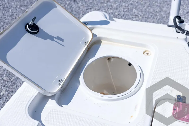 Slide: The Image of Open hatch on 2008 Triton 240 LTS boat, showing storage compartment. - 57