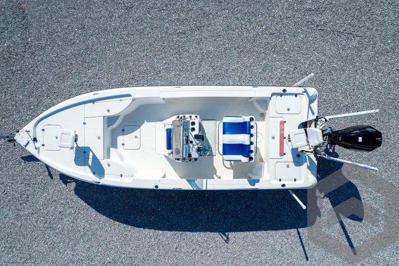 Slide: The Image of Overhead view of 2008 Triton 240 LTS boat on gravel surface. - 64
