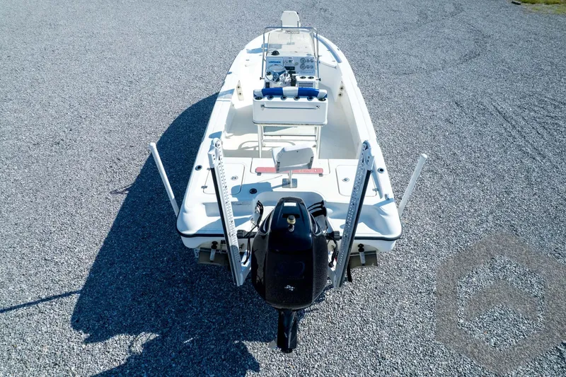 Slide: The Image of 2008 Triton 240 LTS boat, aerial view, parked on gravel surface. - 65