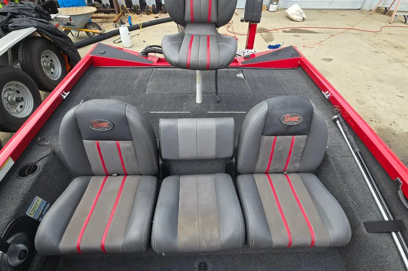 Slide: The Image of 2013 Ranger RT188 boat interior with gray and red seating. - 11
