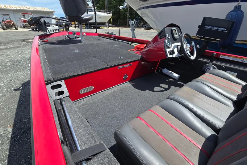 Slide: The Image of 2013 Ranger RT188 boat interior with red accents and seating. - 12
