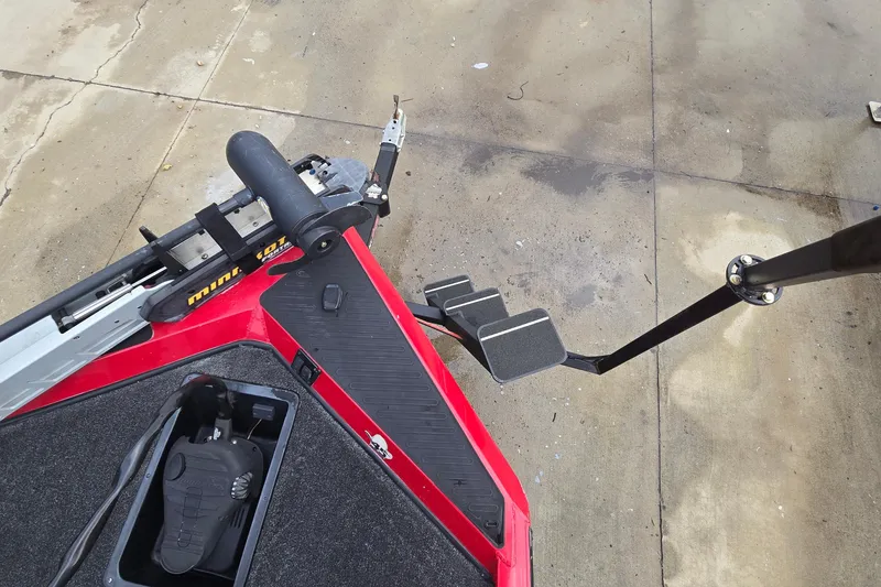 Slide: The Image of 2013 Ranger RT188 boat with trolling motor and foot pedal on concrete surface. - 28