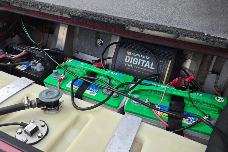 Slide: The Image of 2013 Ranger RT188 boat battery compartment with Minn Kota digital charger. - 34