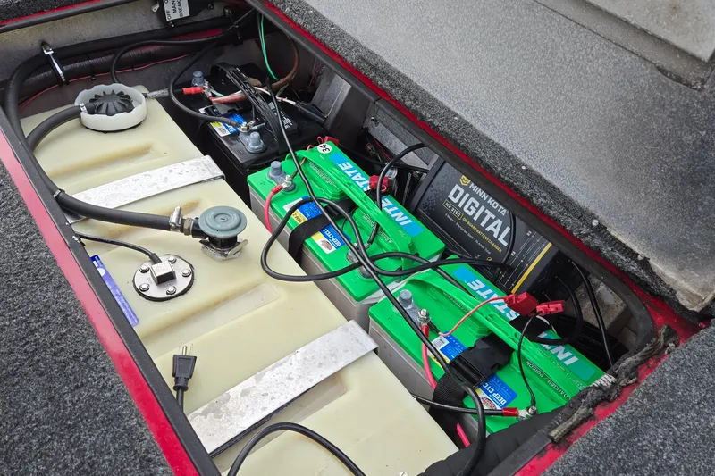 Slide: The Image of 2013 Ranger RT188 boat battery compartment with Minn Kota digital charger and Interstate batteries. - 35