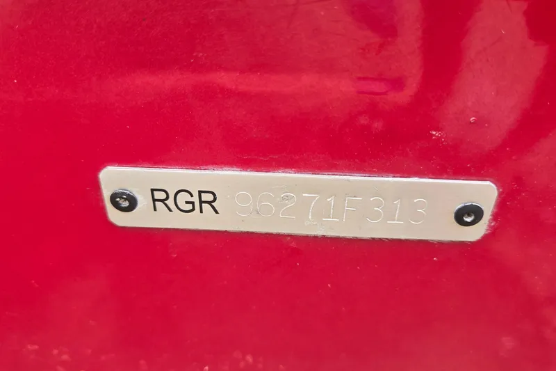 Slide: The Image of Ranger RT188 2013 model identification plate on red surface. - 36