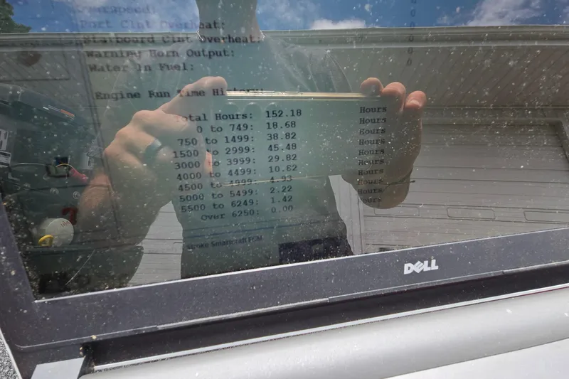 Slide: The Image of Reflection on laptop screen showing engine run time data for Ranger RT188, 2013 model. - 38