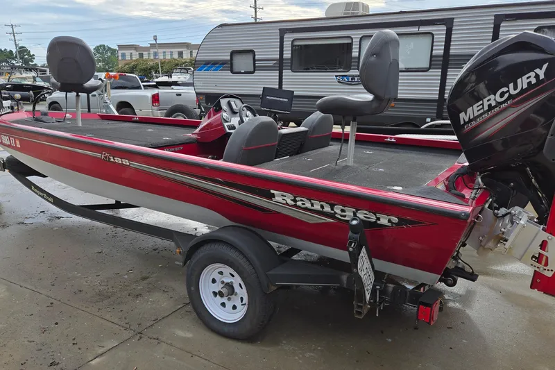 Slide: The Image of 2013 Ranger RT188 red fishing boat with Mercury engine on trailer. - 4
