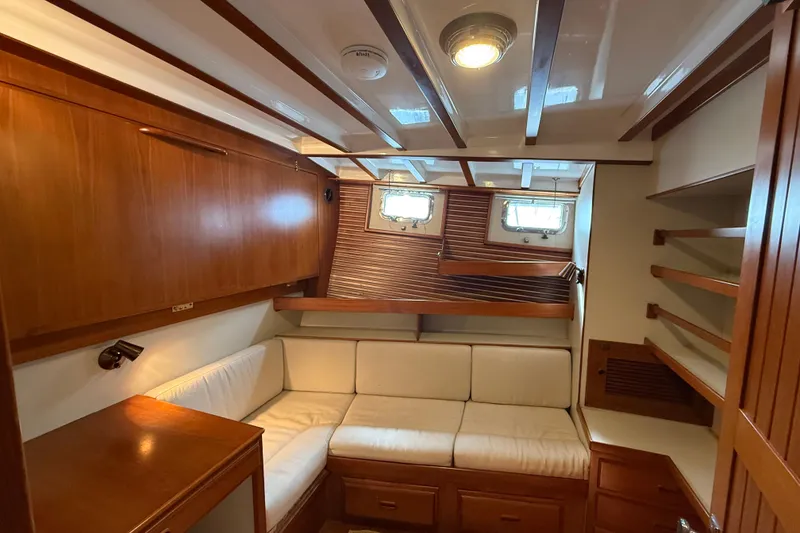 Slide: The Image of Cozy interior of 1994 Kadey-Krogen Krogen 42 yacht with wooden cabinetry and seating. - 12