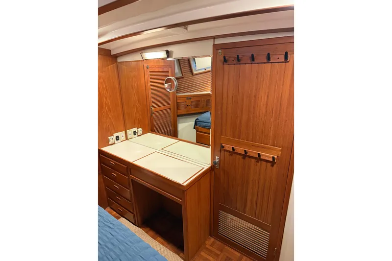 Slide: The Image of 1994 Kadey-Krogen Krogen 42 yacht interior with wooden cabinetry and mirror. - 13