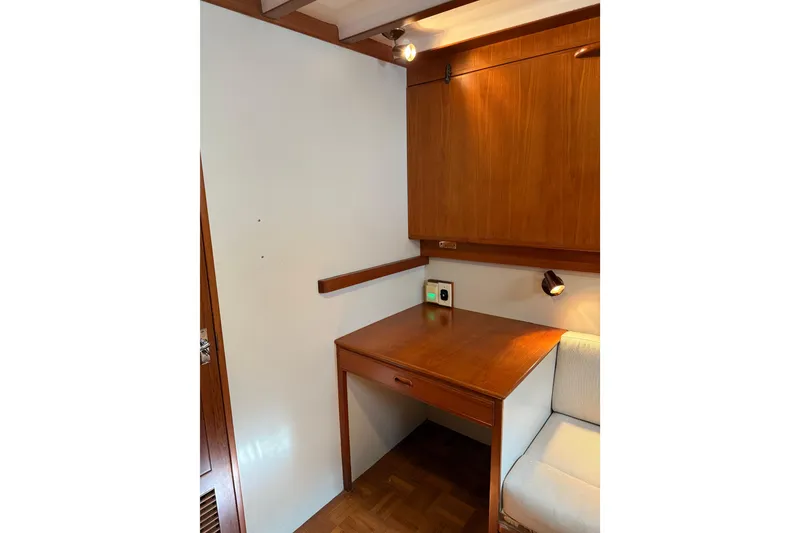 Slide: The Image of 1994 Kadey-Krogen Krogen 42 interior with wooden desk and cabinetry. - 14