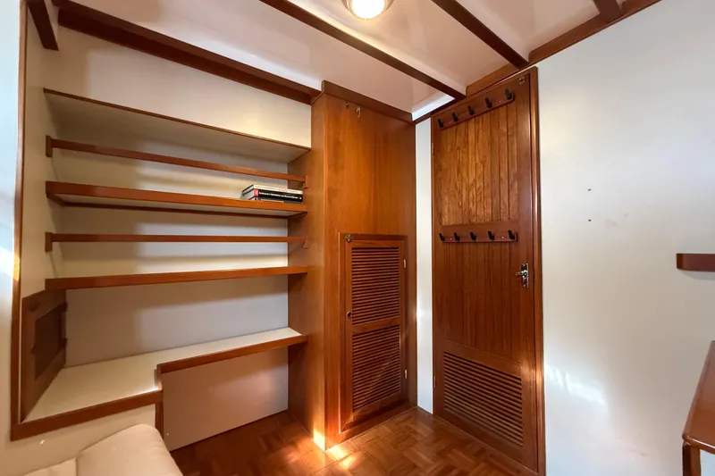Slide: The Image of Wooden interior of 1994 Kadey-Krogen Krogen 42 with shelves and door. - 16