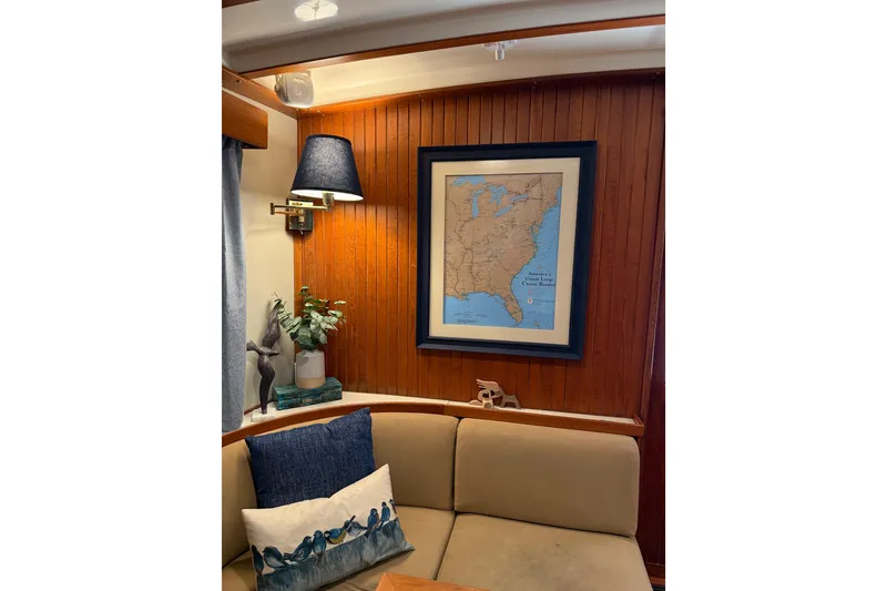 Slide: The Image of Cozy 1994 Kadey-Krogen Krogen 42 interior with map, lamp, and decorative pillows. - 2