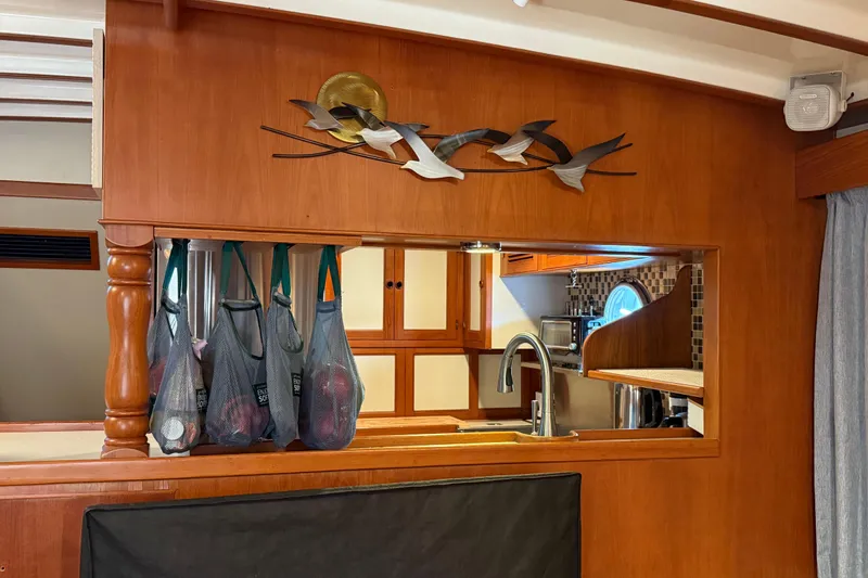 Slide: The Image of Interior of 1994 Kadey-Krogen Krogen 42 yacht kitchen with wooden cabinetry and modern fixtures. - 5