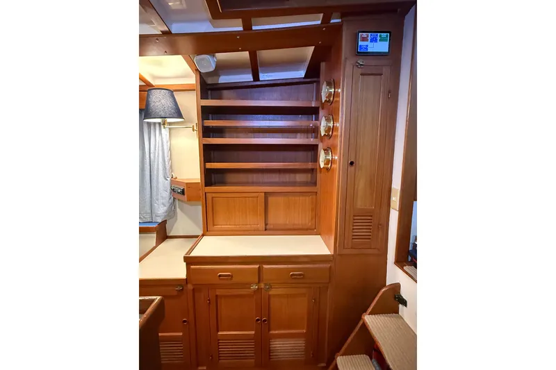 Slide: The Image of Interior of 1994 Kadey-Krogen Krogen 42 yacht with wooden cabinetry and shelving. - 6