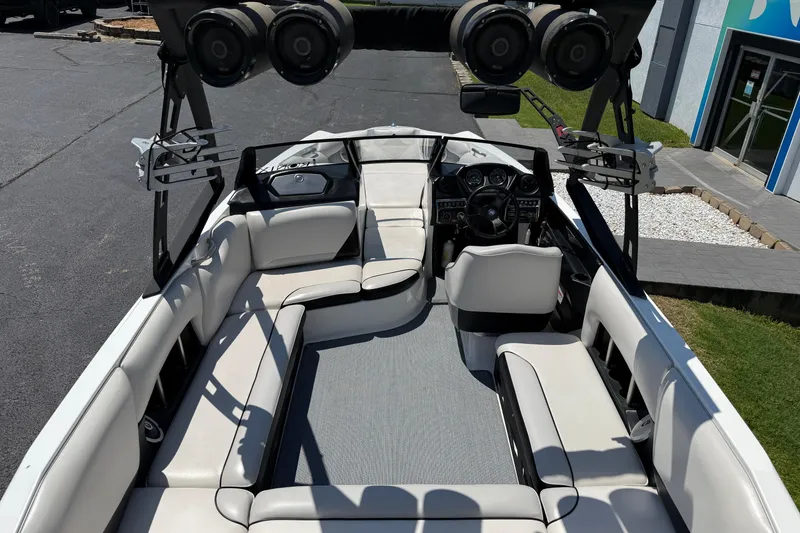 Slide: The Image of 2014 Axis A22 boat interior with white seating and advanced audio system. - 18