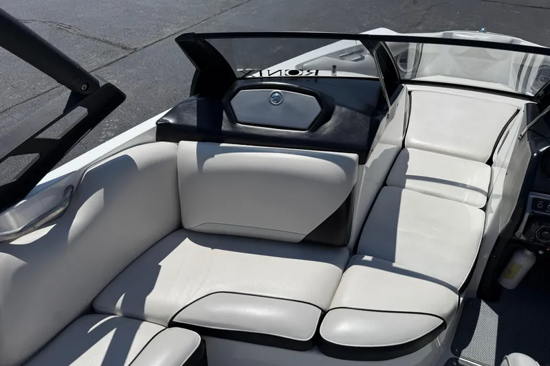 Slide: The Image of Interior of 2014 Axis A22 boat with white leather seating and sleek design. - 21