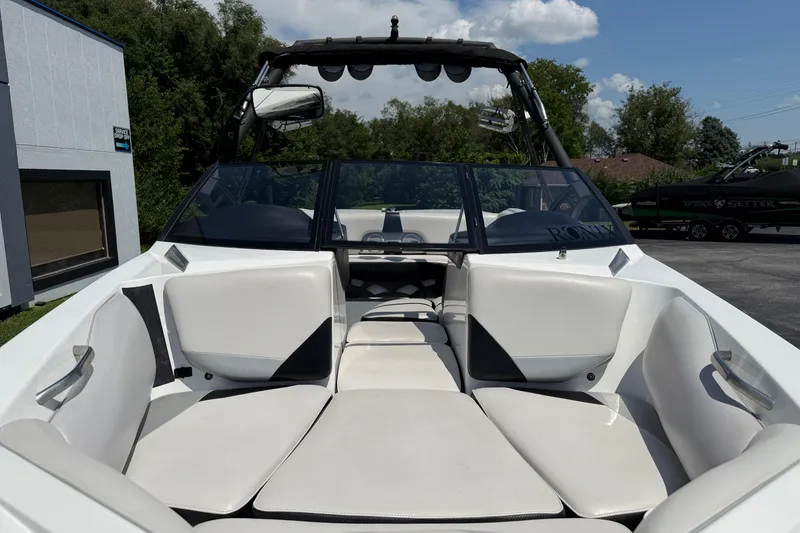 Slide: The Image of 2014 Axis A22 boat interior with white seating and sleek design. - 6