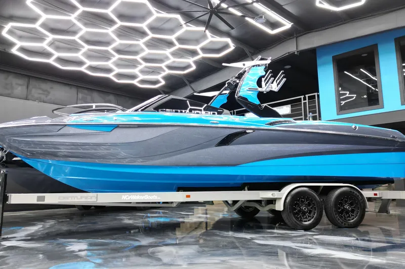 The Image of 2020 Centurion Fi25 boat in showroom with modern lighting and sleek design. - 1