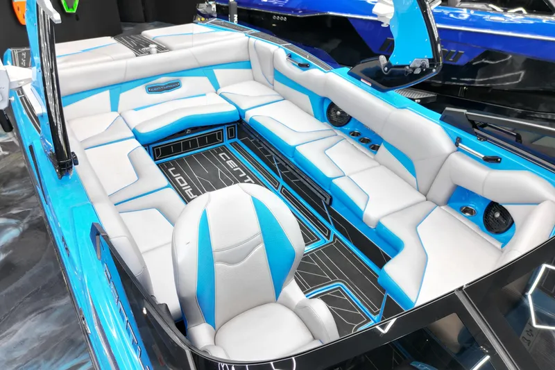 Slide: The Image of 2020 Centurion Fi25 boat interior with blue and white seating, modern design. - 8