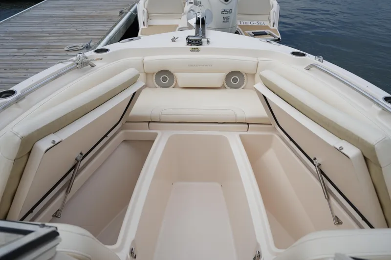 Slide: The Image of 2018 Grady-White Freedom 235 boat interior with open storage compartments. - 19