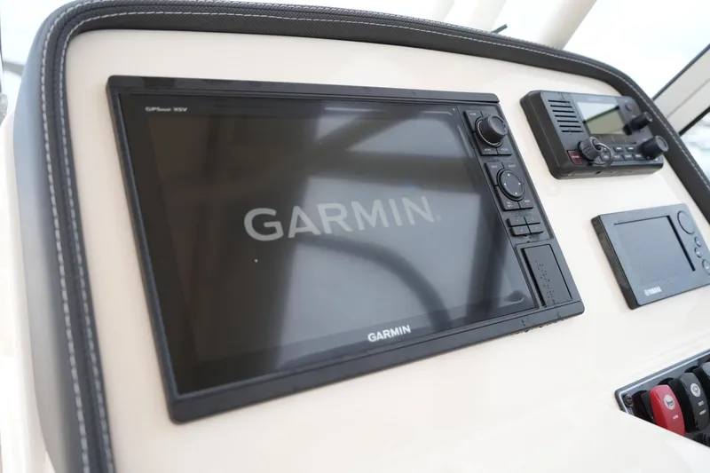Slide: The Image of Garmin navigation system on 2018 Grady-White Freedom 235 boat dashboard. - 26