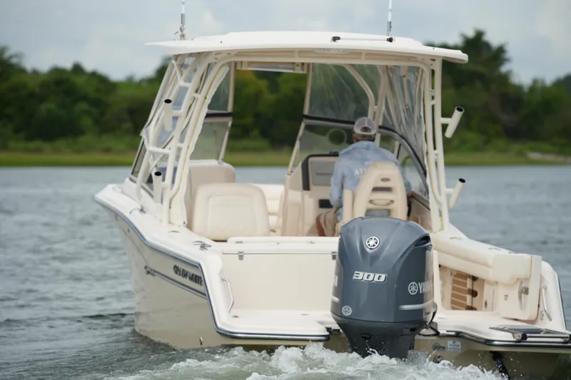 Slide: The Image of 2018 Grady-White Freedom 235 boat with Yamaha 300 engine on water. - 3