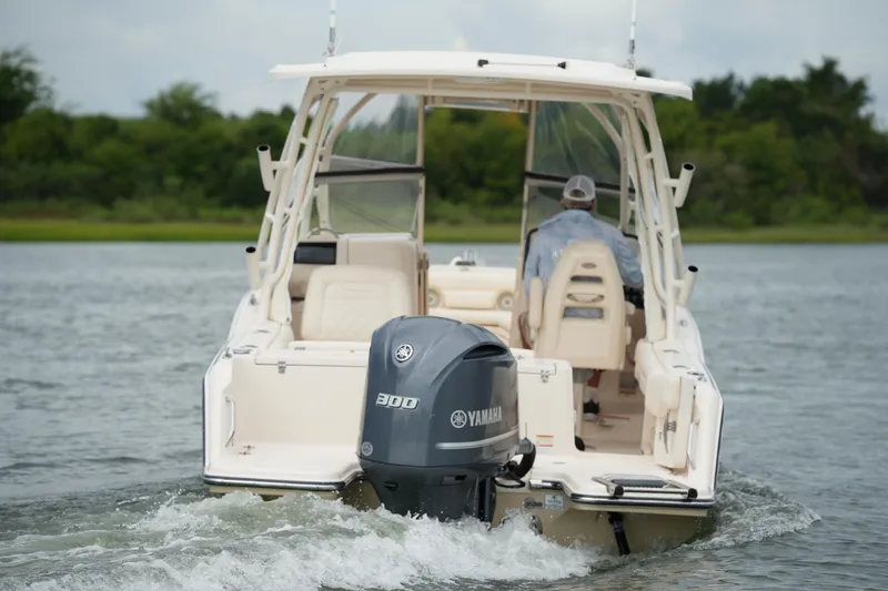 Slide: The Image of 2018 Grady-White Freedom 235 boat with Yamaha 300 engine on water. - 4
