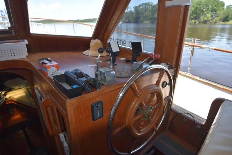 Slide: The Image of Cozy cabin interior of 1985 Albin 43 Trawler with floral bedding and wooden finish. - 17