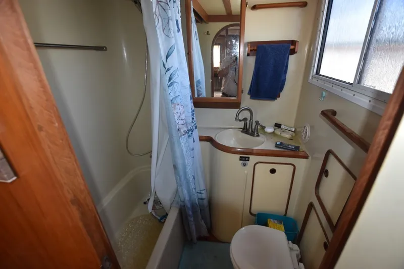 Slide: The Image of Engine room of 1985 Albin 43 Trawler with red machinery and wiring. - 21