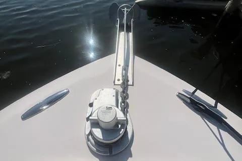 Slide: The Image of Bow of 2013 Grady-White Freedom 275 boat with anchor chain in sunlight. - 19