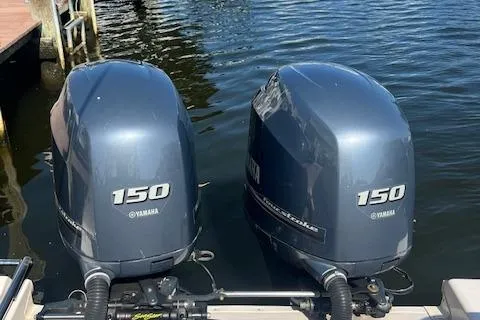 Slide: The Image of Twin Yamaha 150 outboard engines on a 2013 Grady-White Freedom 275 boat. - 20