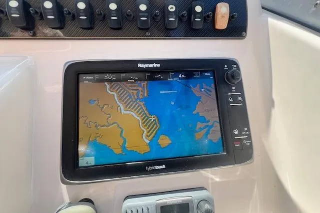 Slide: The Image of Raymarine navigation system on 2013 Grady-White Freedom 275 boat dashboard. - 5