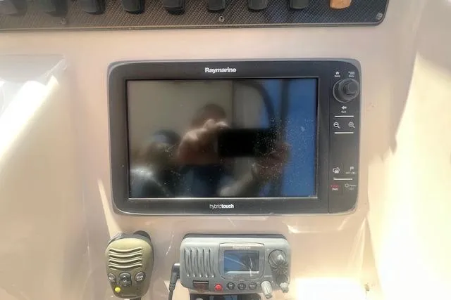 Slide: The Image of Control panel of a 2013 Grady-White Freedom 275 boat with Raymarine electronics. - 6