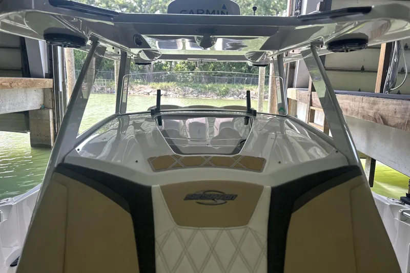 Slide: The Image of 2019 Sunsation 34 CCX boat interior with beige and black seating, diamond stitching. - 12