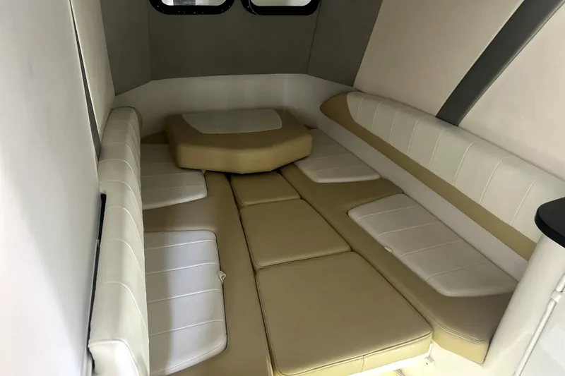 Slide: The Image of 2019 Sunsation 34 CCX boat docked in a boathouse with water view. - 16