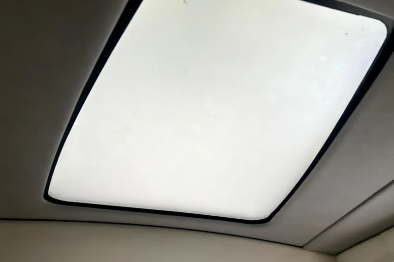 Slide: The Image of 2019 Sunsation 34 CCX cabin interior with seating, sink, and control panel. - 22