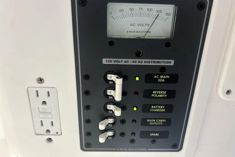 Slide: The Image of 2019 Sunsation 34 CCX boat bathroom with sink, toilet, and storage. - 25