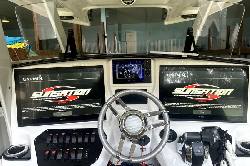 Slide: The Image of 2019 Sunsation 34 CCX boat seats with beige and white diamond pattern upholstery. - 32