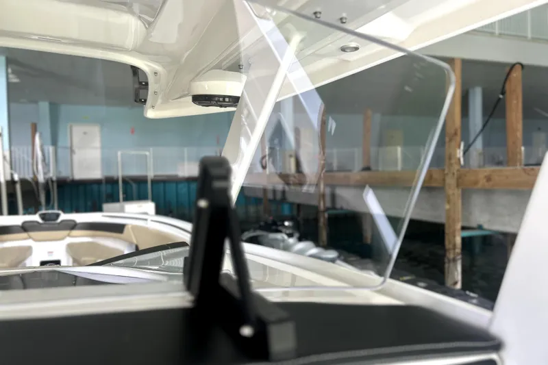 Slide: The Image of 2019 Sunsation 34 CCX boat dashboard with Garmin displays and steering wheel. - 36