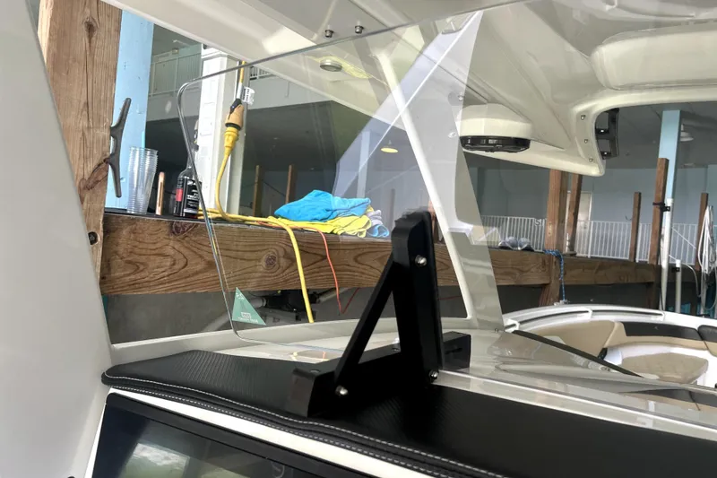 Slide: The Image of 2019 Sunsation 34 CCX boat dashboard with Garmin displays and steering wheel. - 37