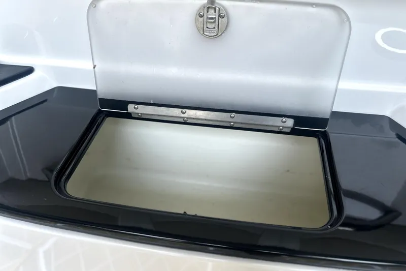 Slide: The Image of Open storage compartment on a 2019 Sunsation 34 CCX boat. - 50