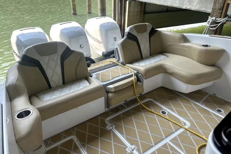 Slide: The Image of 2019 Sunsation 34 CCX boat interior with luxurious seating and Mercury outboard engines. - 52